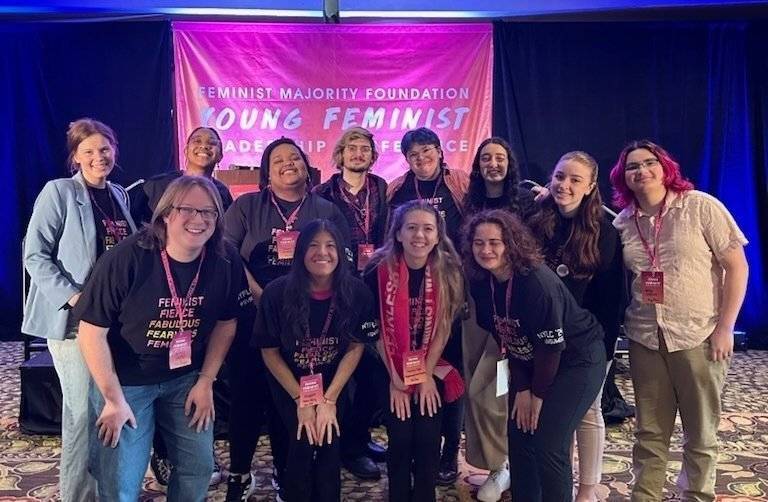 A photo of a group of students at a conference